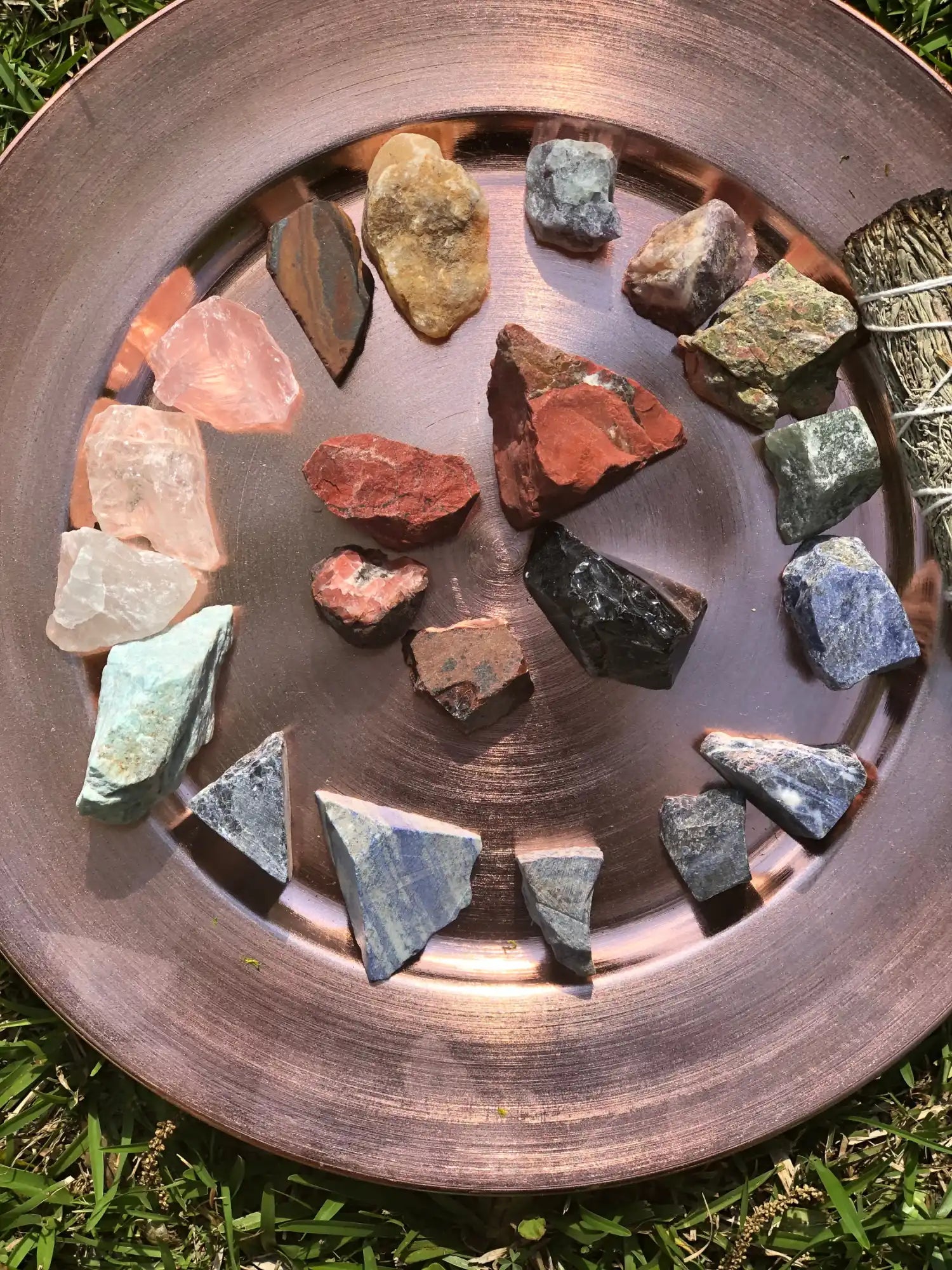 A collection of rough, natural crystals and stones in various colors and shapes.