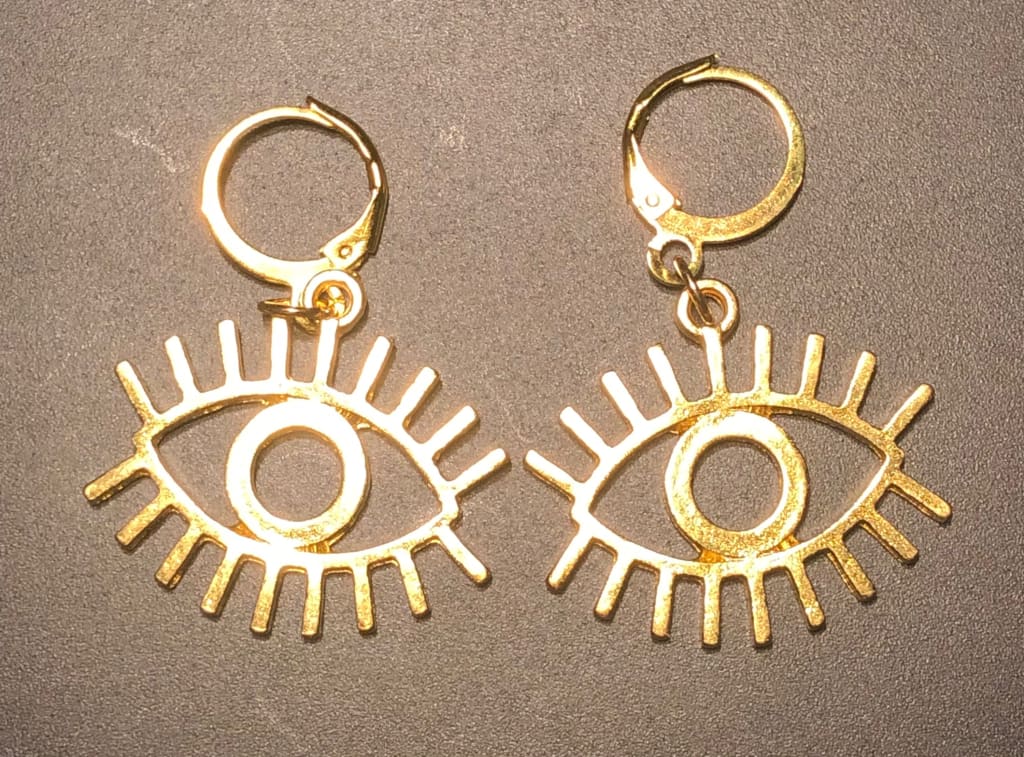 Evil eye x gold huggie earrings - Earrings