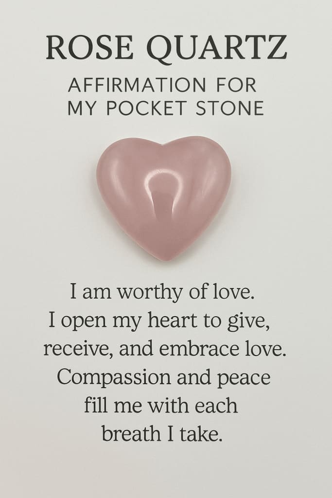 Heart-shaped rose quartz stone with affirmation text on a light gray background